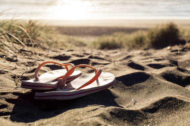 Jandals at the beach cover photo